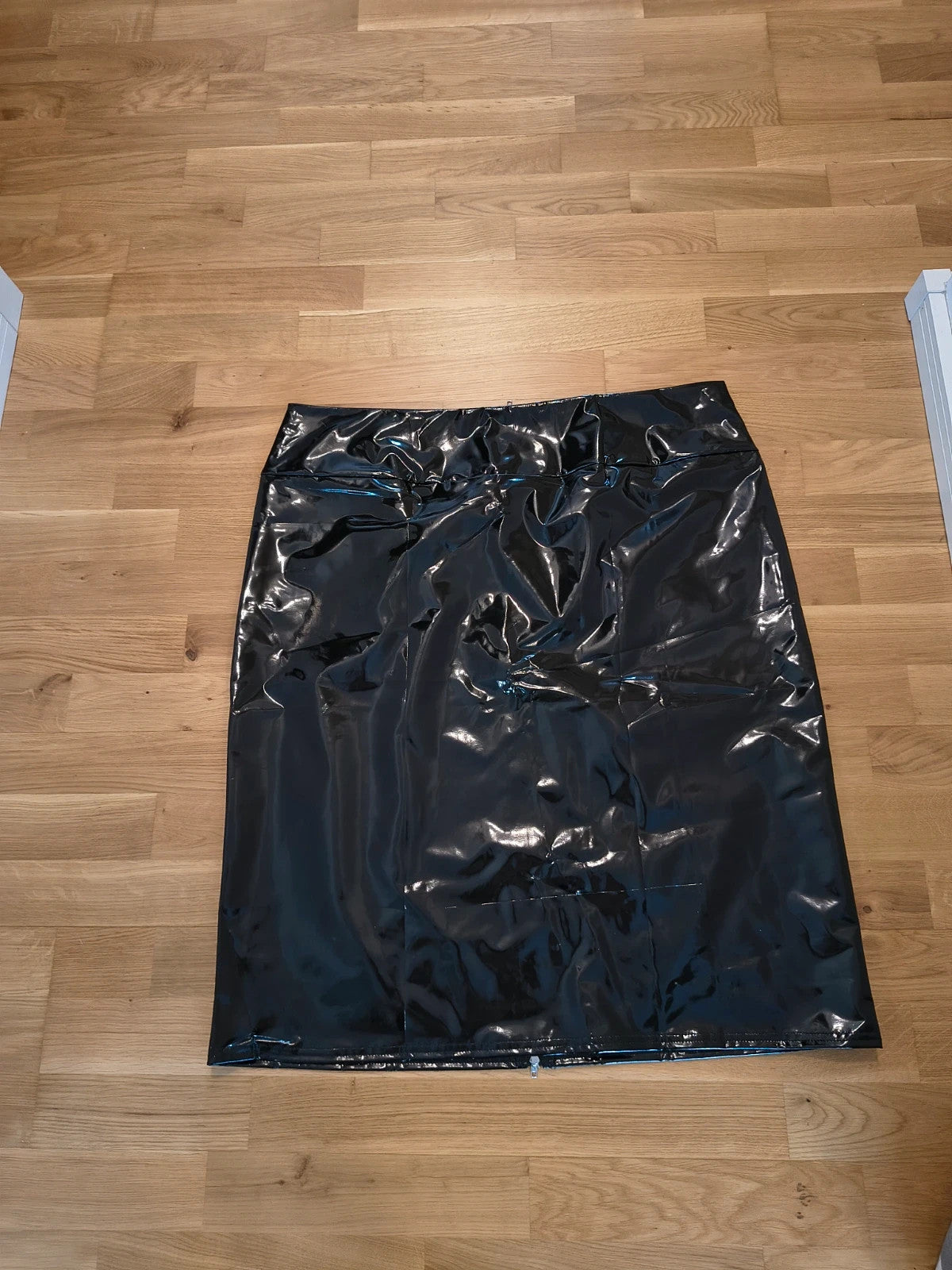REI black wetlook midi skirt high waist with shiny finish and back zipper.