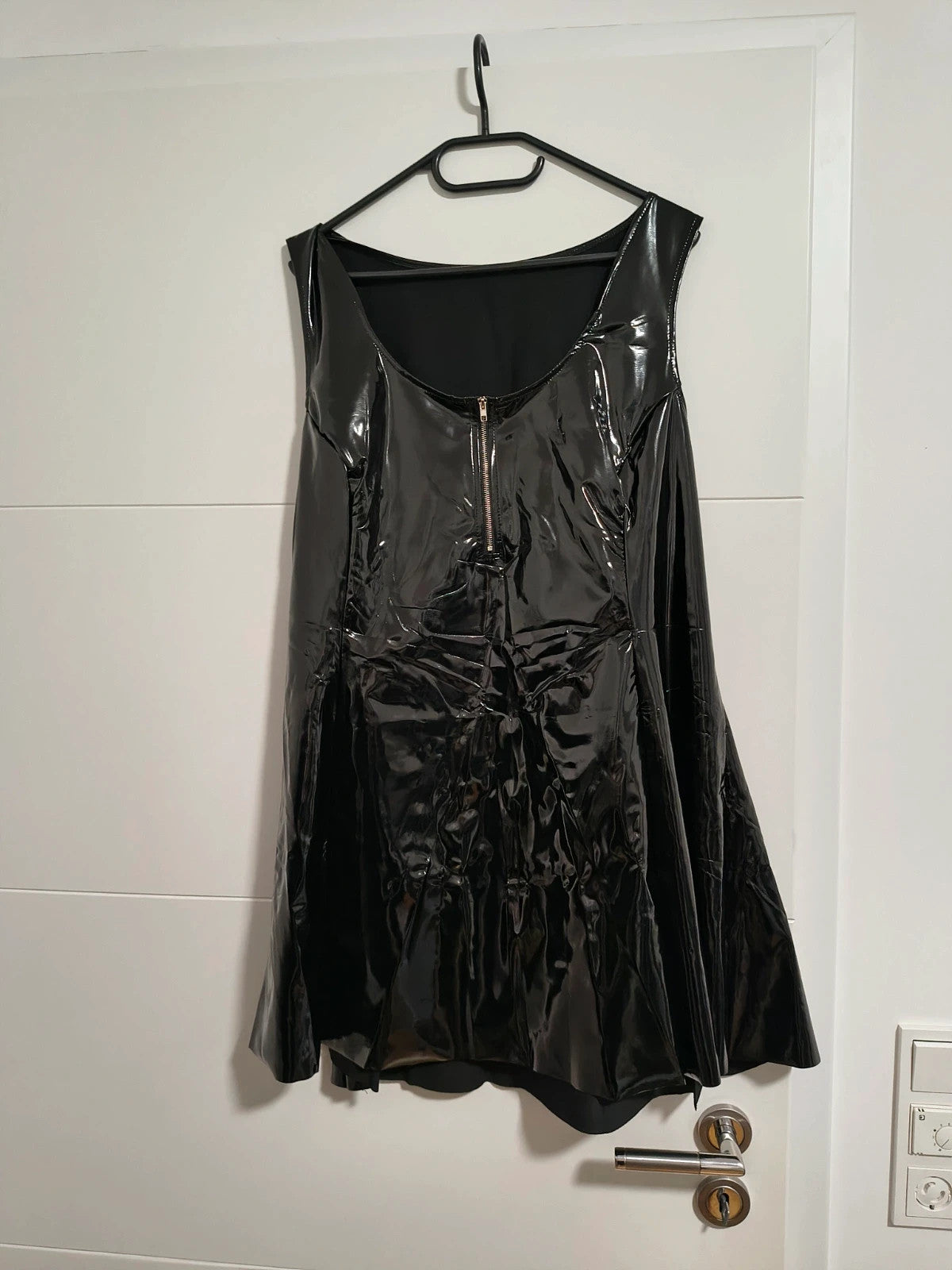 REI black bandage dress glossy wetlook with flared skirt and front zipper detail.