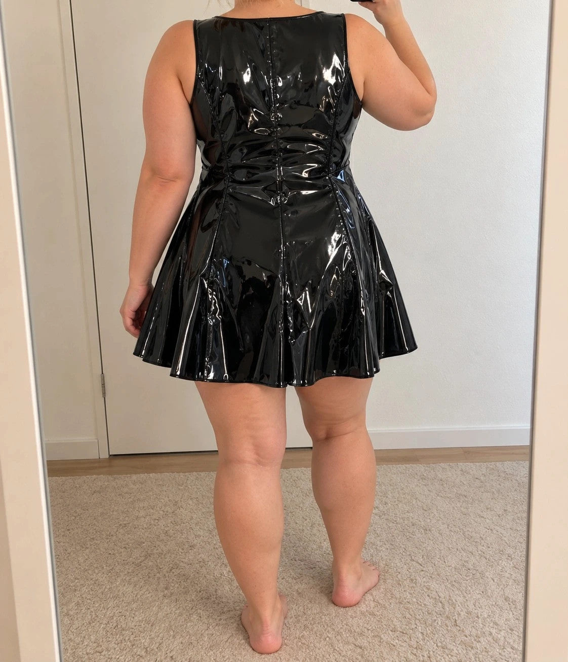 REI black bandage dress glossy wetlook with flared skirt and front zipper detail.