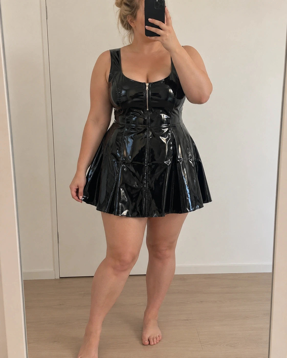 REI black bandage dress glossy wetlook with flared skirt and front zipper detail.