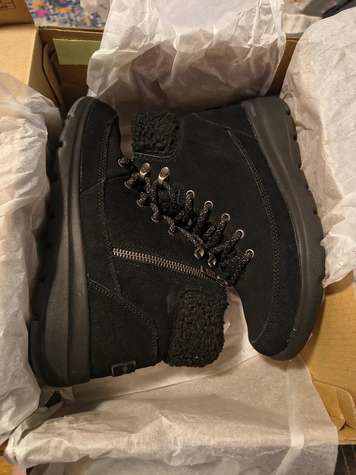 Skechers black winter boots suede with Sherpa lining and side zipper detail.