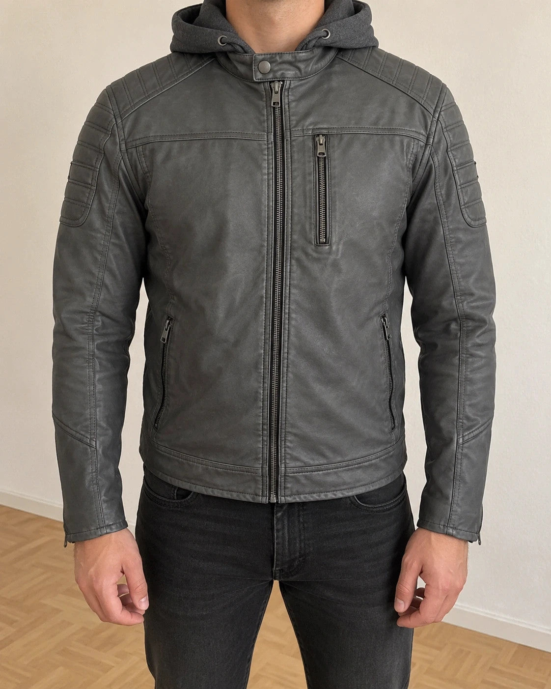 Indicode grey biker jacket with logo, padded hood, and quilted shoulder details.