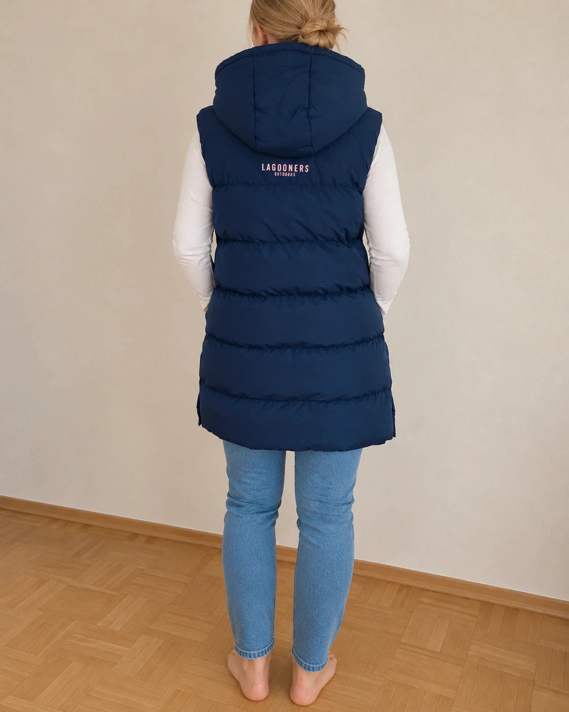 Lagooners navy vest with pink accents, quilted design, logo on chest, hooded.