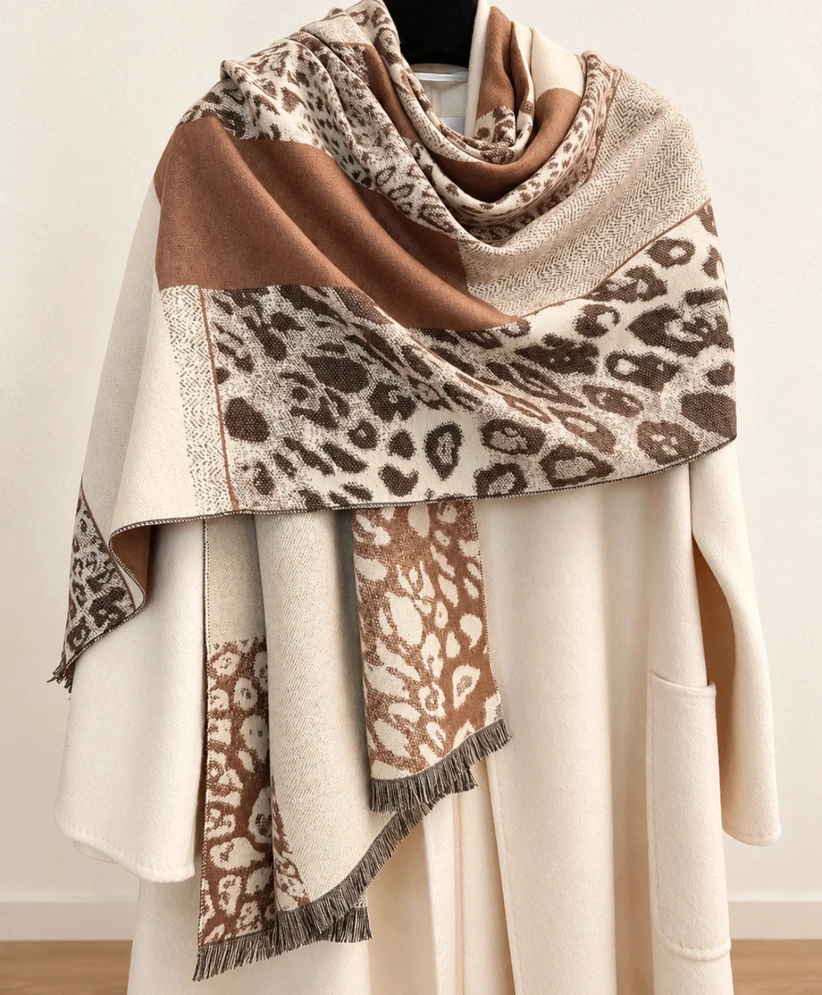 Muster beige brown shawl leopard pattern soft polyester with decorative fringes.