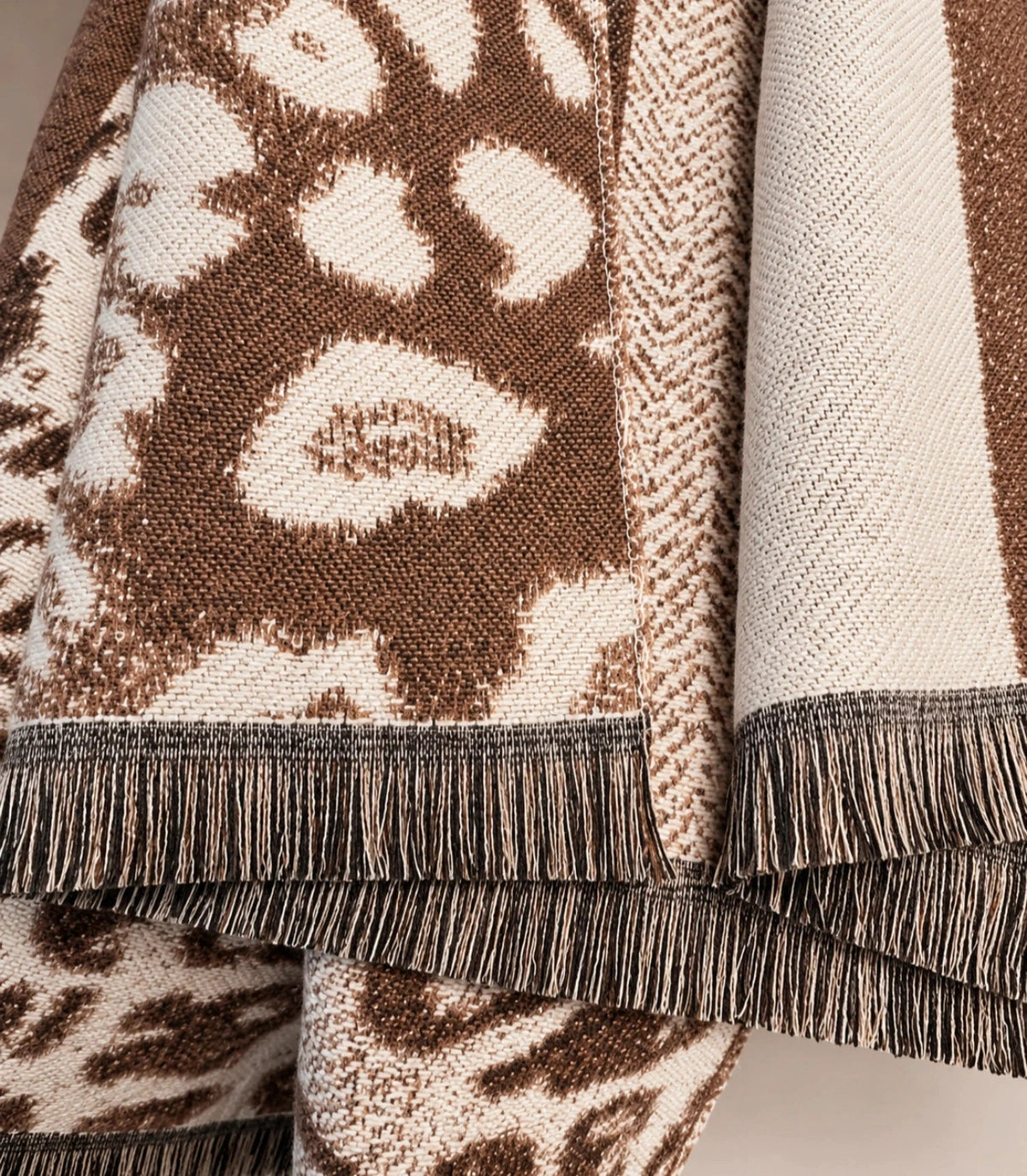 Muster beige brown shawl leopard pattern soft polyester with decorative fringes.