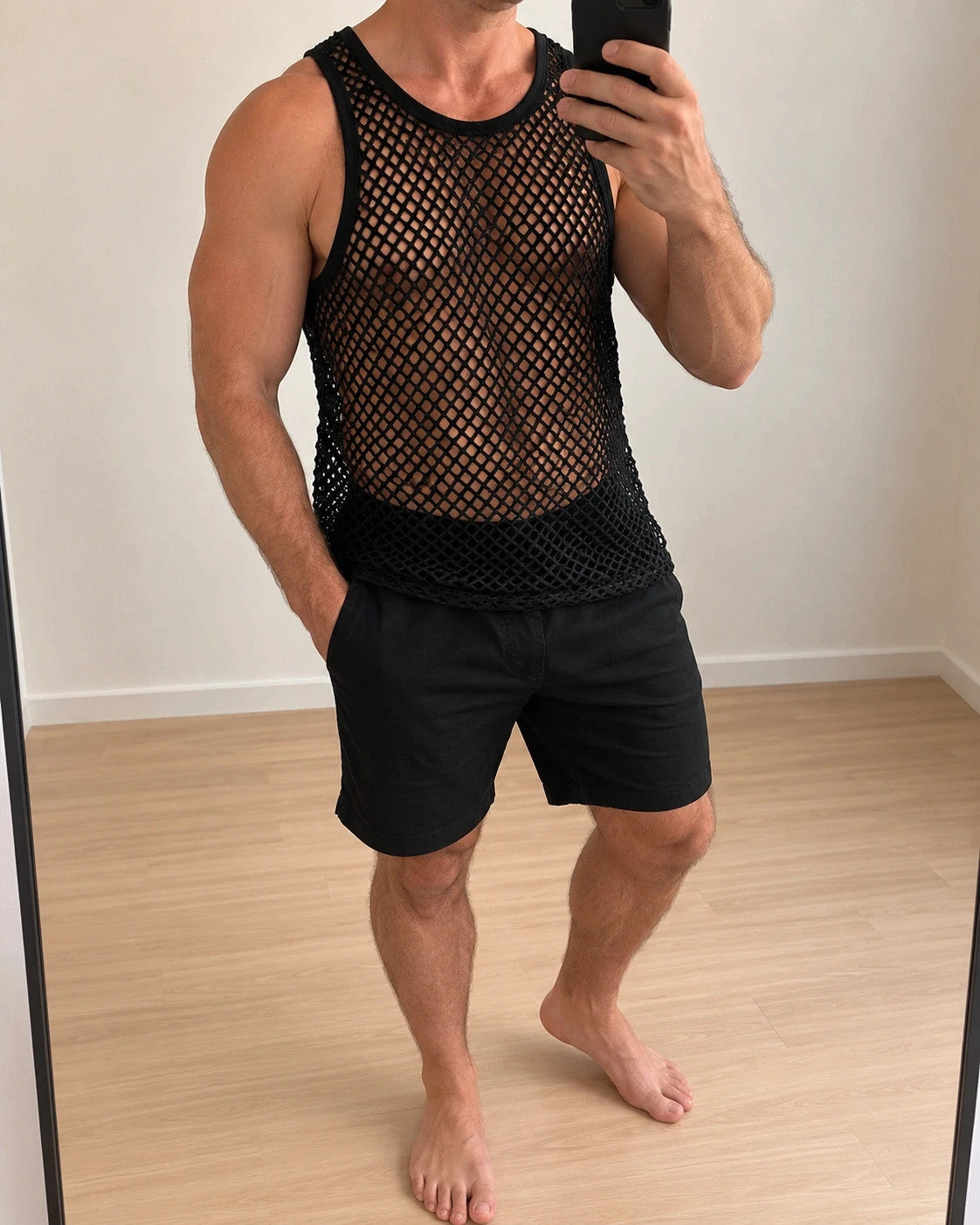 ALS black mesh tank top with round neckline and transparent pattern.