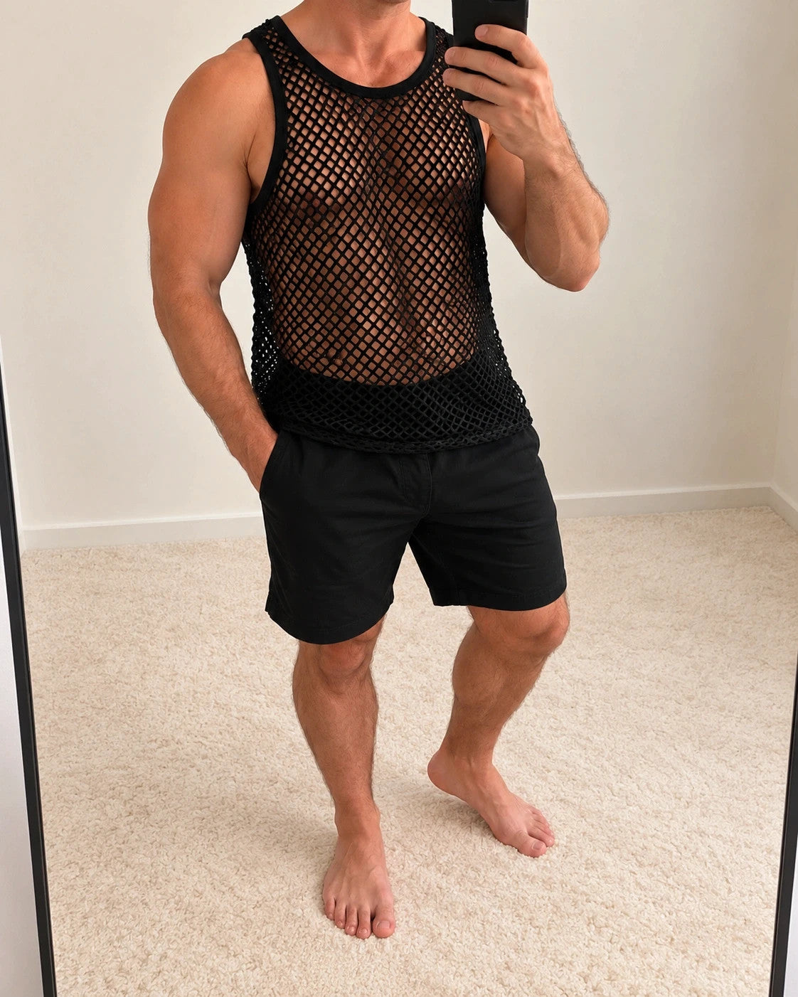 Stoff black tank top sleeveless mesh fabric with open hole pattern and round neckline.