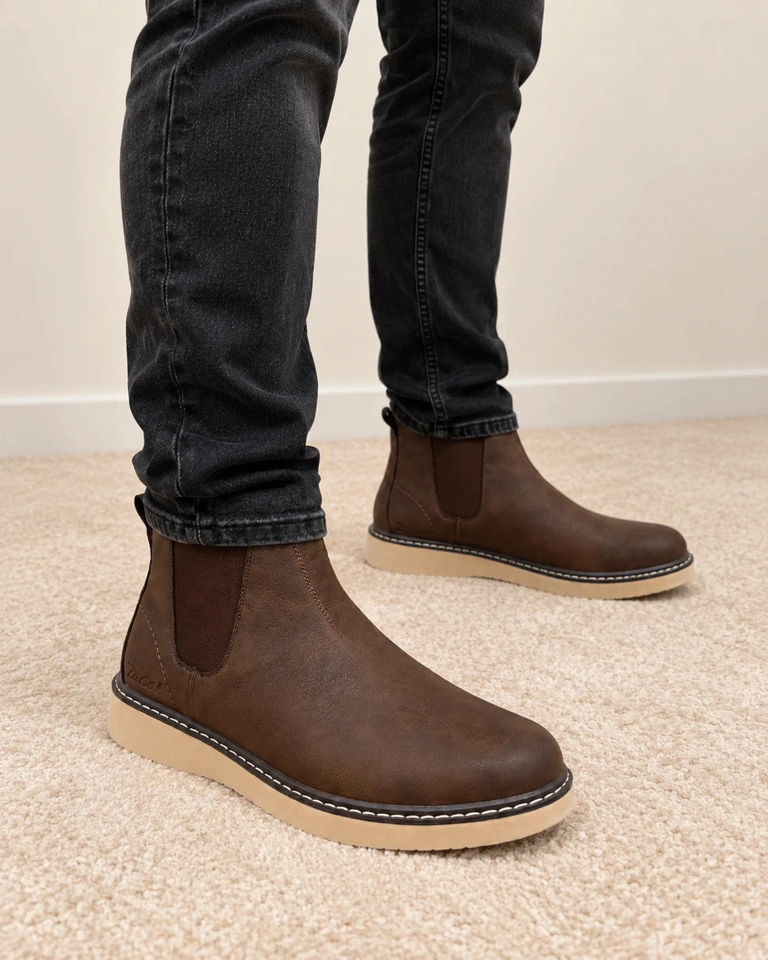 MCS brown winter boots size 43 with elastic side panels and cream-colored sole.