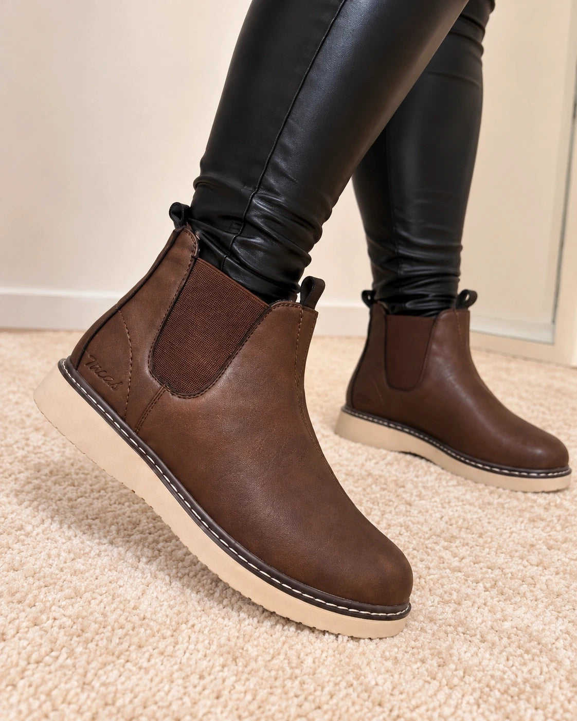 MCS brown winter boots size 43 with elastic side panels and cream-colored sole.