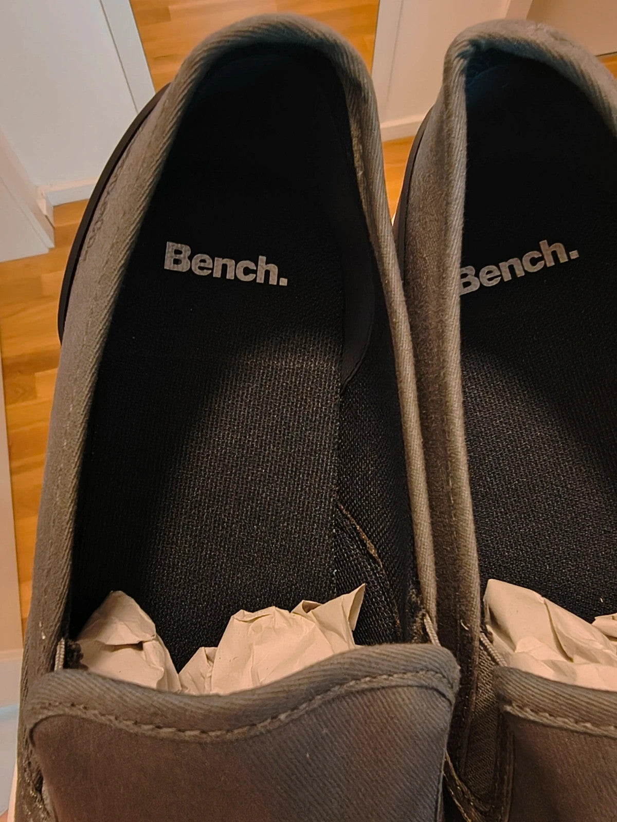 Bench grey slip-on trainers with white rubber sole and dark heel accents.