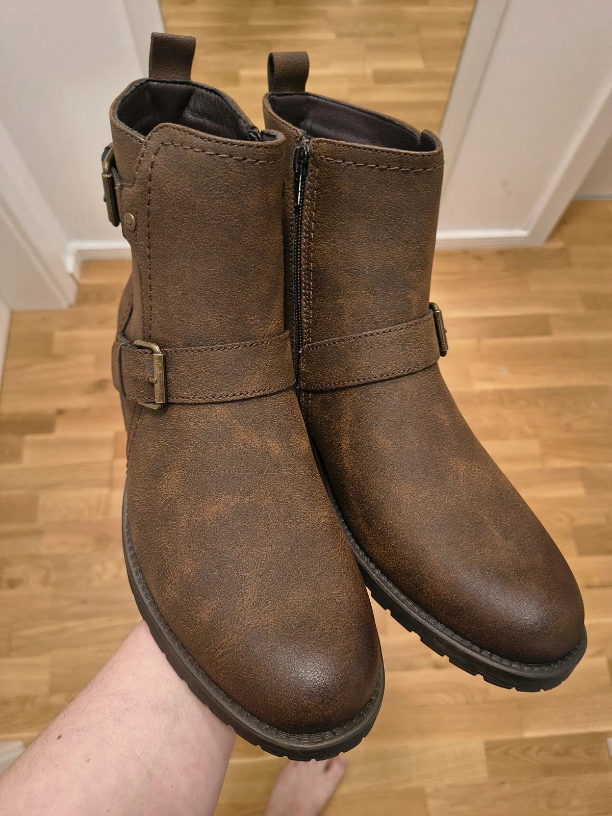 Deakins brown biker boots with antique metal buckles and side zipper, robust leather look.
