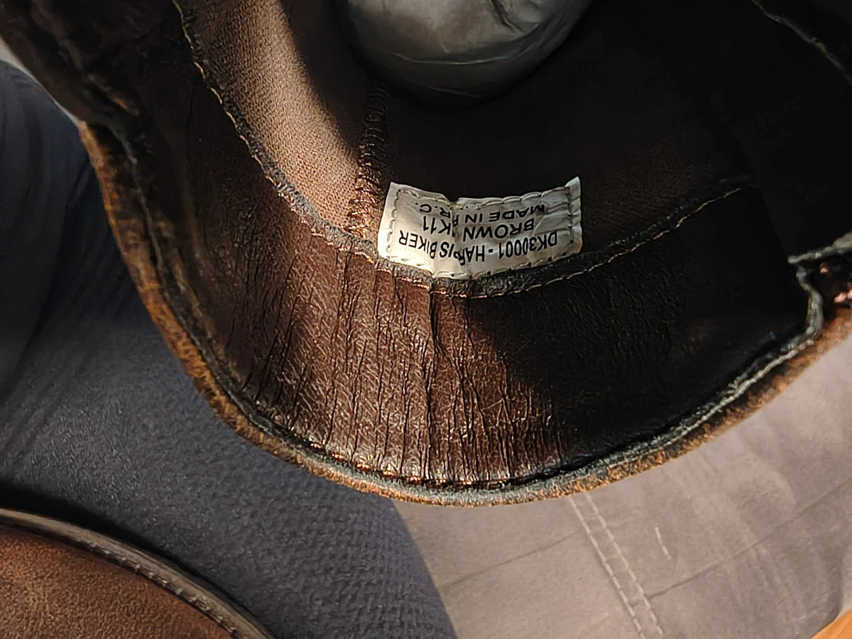 Deakins brown biker boots with antique metal buckles and side zipper, robust leather look.