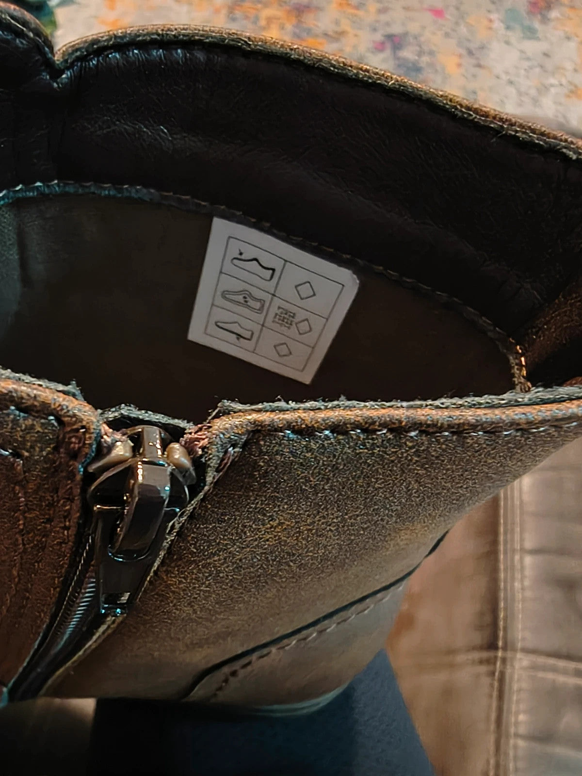 Deakins brown biker boots with antique metal buckles and side zipper, robust leather look.