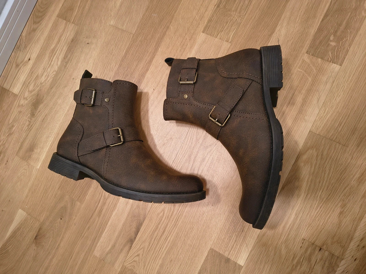 Deakins brown biker boots with antique metal buckles and side zipper, robust leather look.