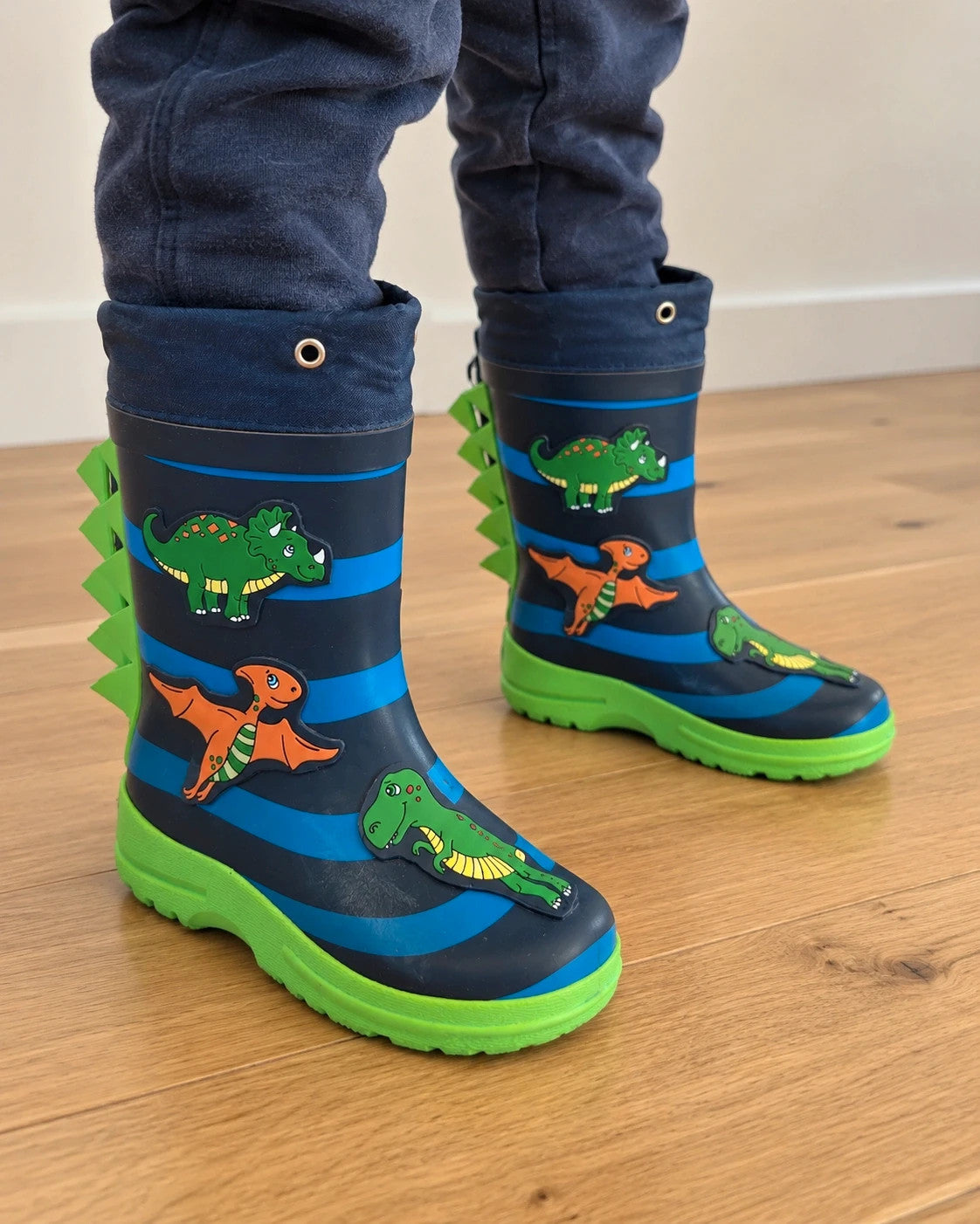 Beck blue and green children's rain boots with dinosaur patterns and rubber sole.