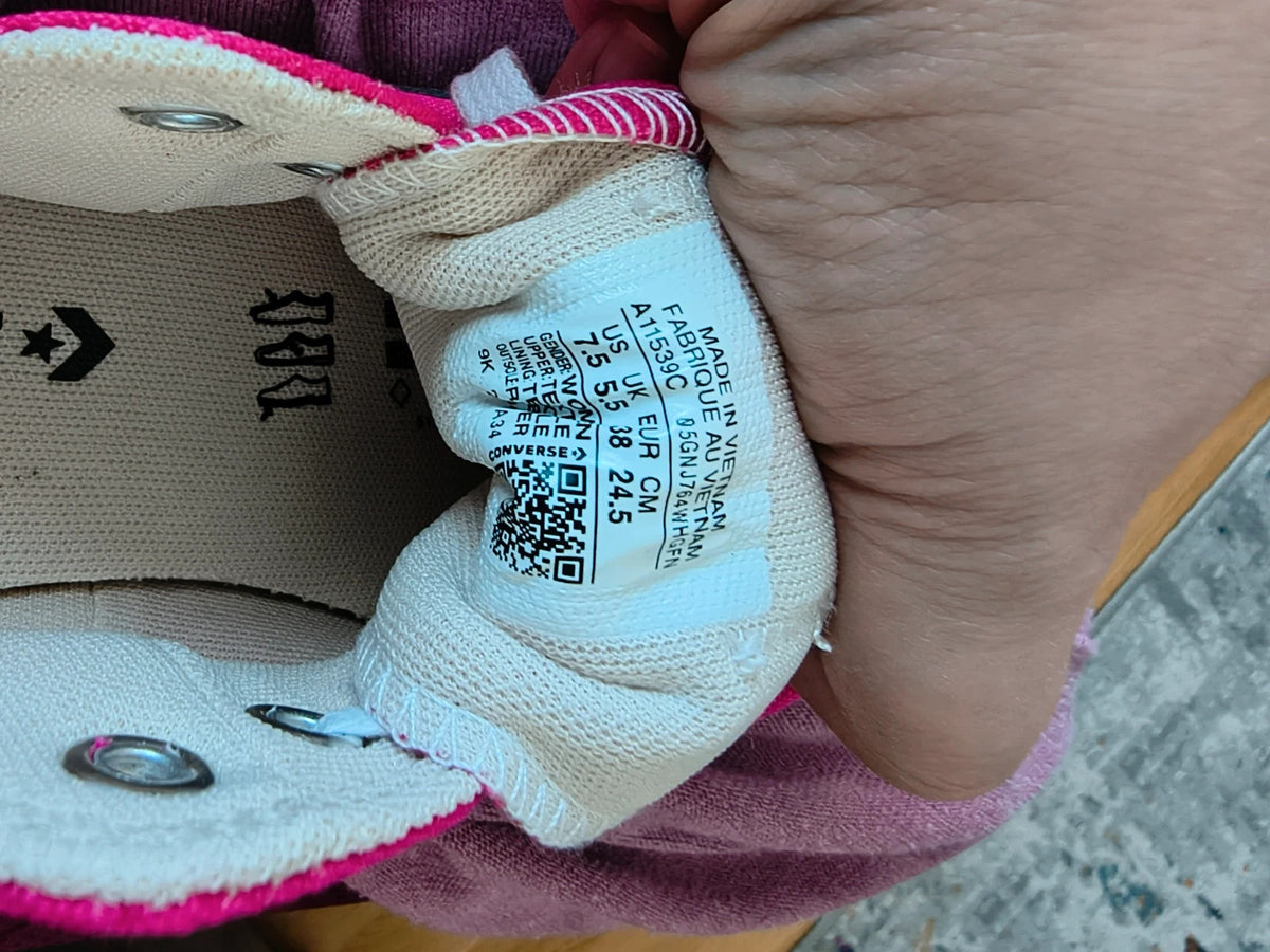 Converse pink Chuck Taylor All Star Lift Platform sneakers with white sole and logo.