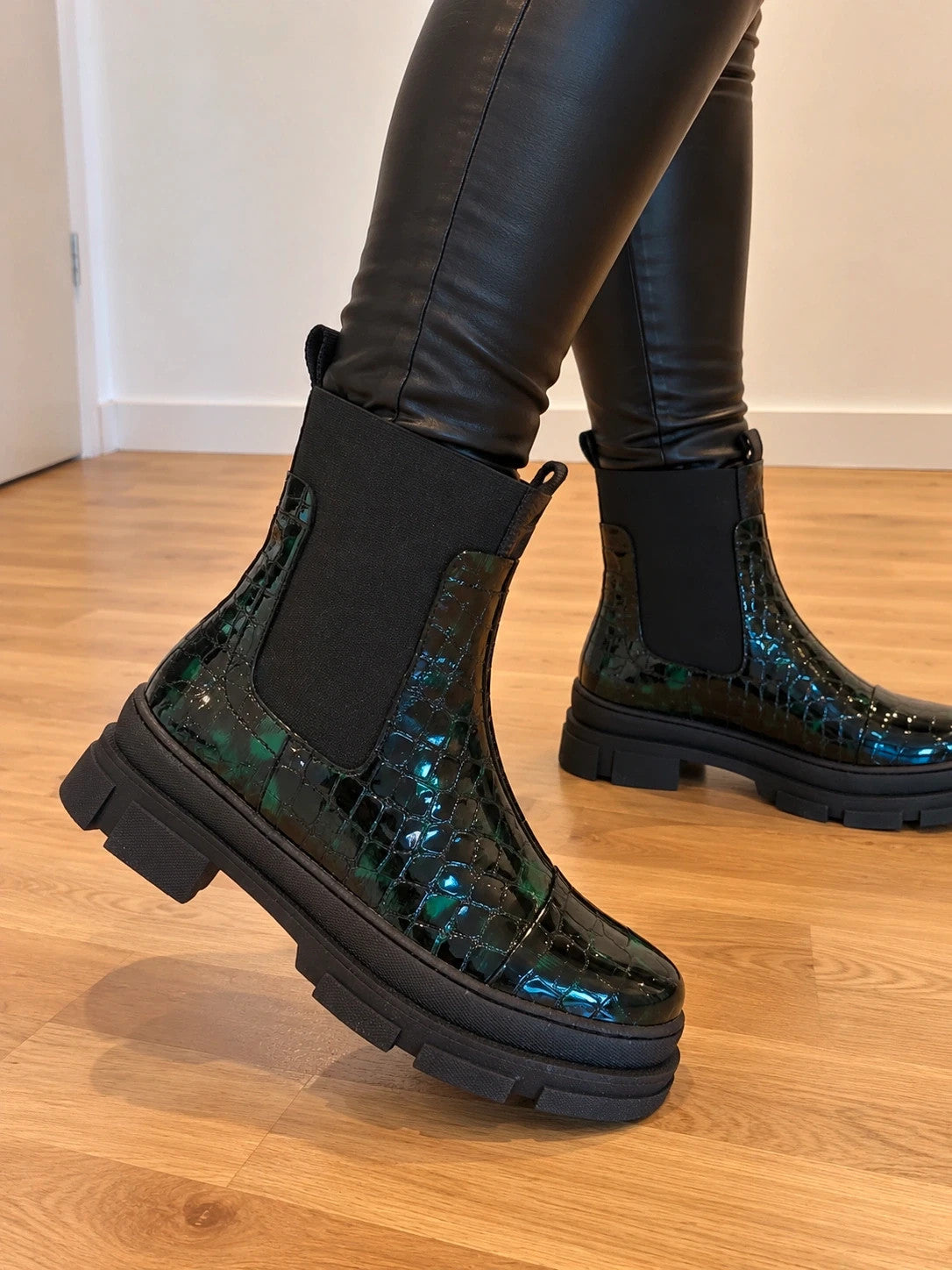 Copenhagen Shoes black and green leather Chelsea boots with crocodile pattern and elastic side inserts.