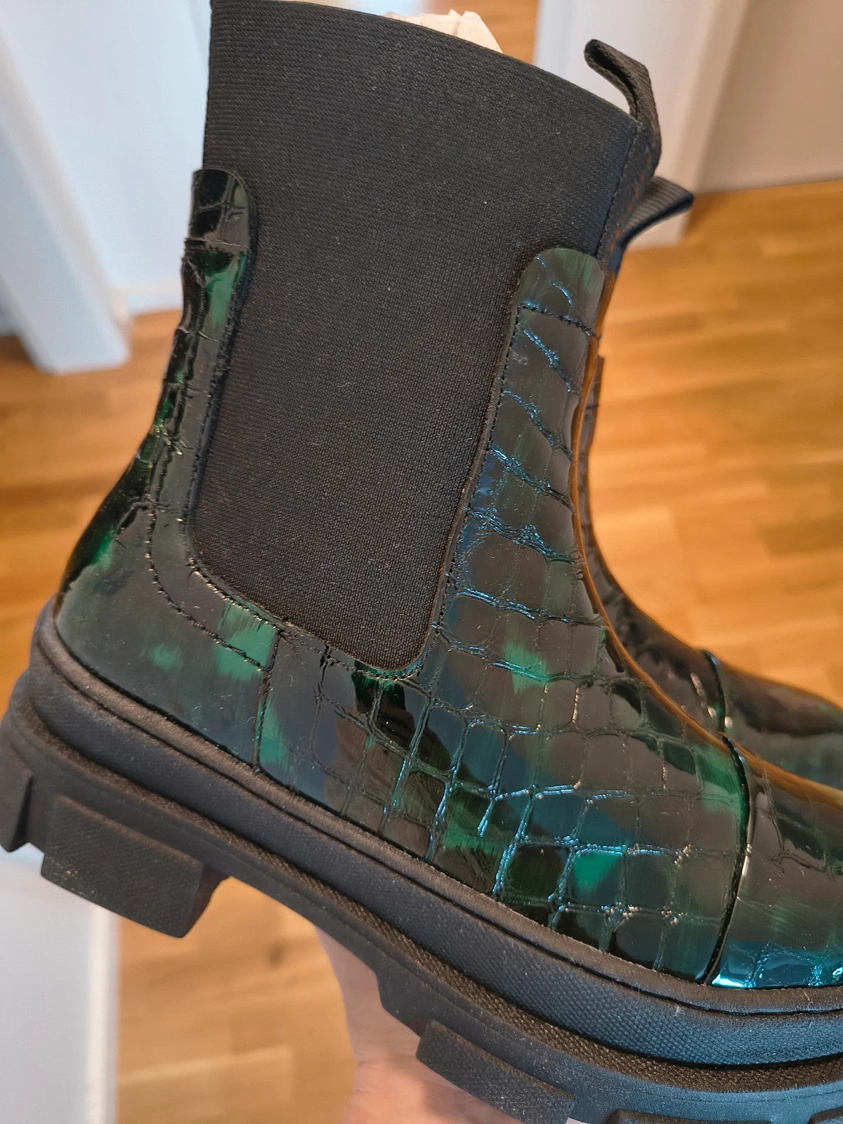 Copenhagen Shoes black and green leather Chelsea boots with crocodile pattern and elastic side inserts.