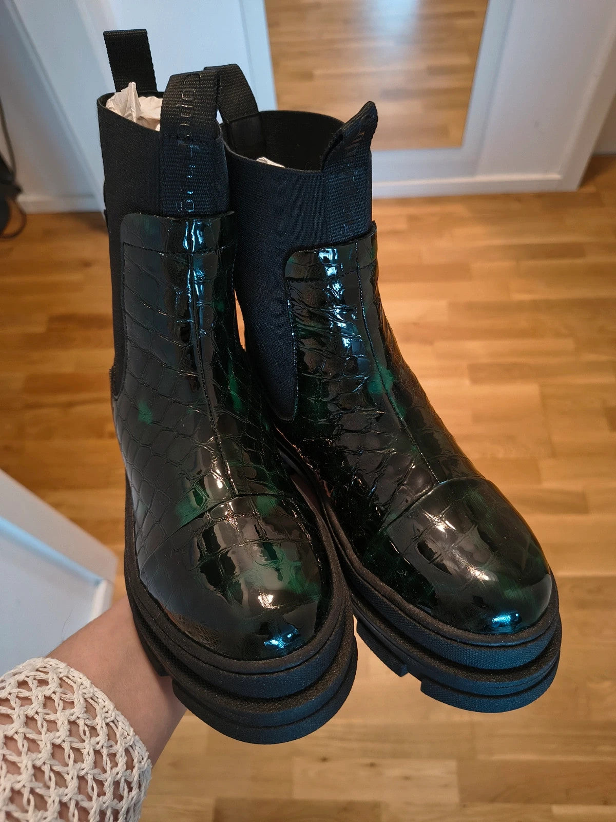 Copenhagen Shoes black and green leather Chelsea boots with crocodile pattern and elastic side inserts.