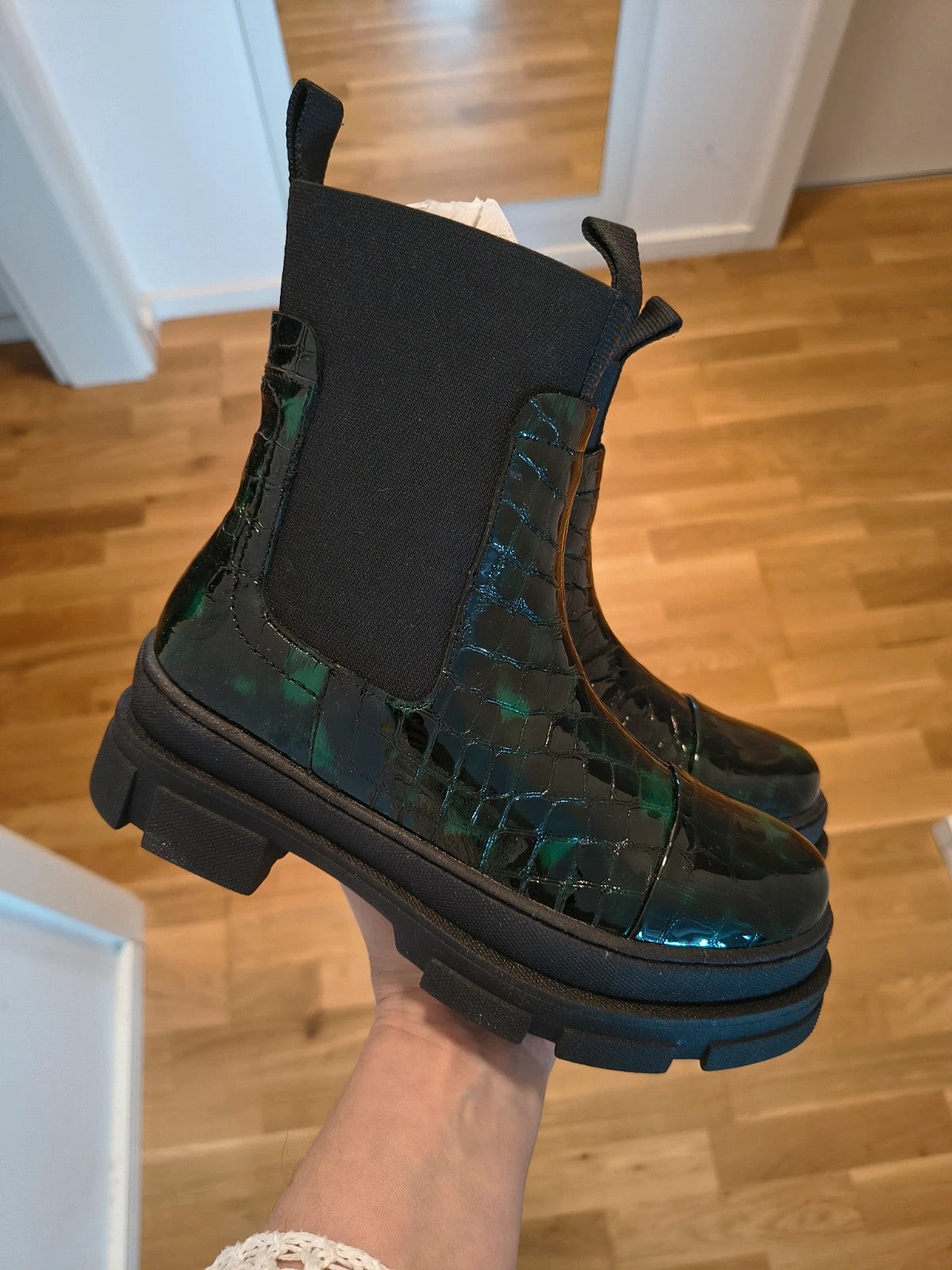 Copenhagen Shoes black and green leather Chelsea boots with crocodile pattern and elastic side inserts.