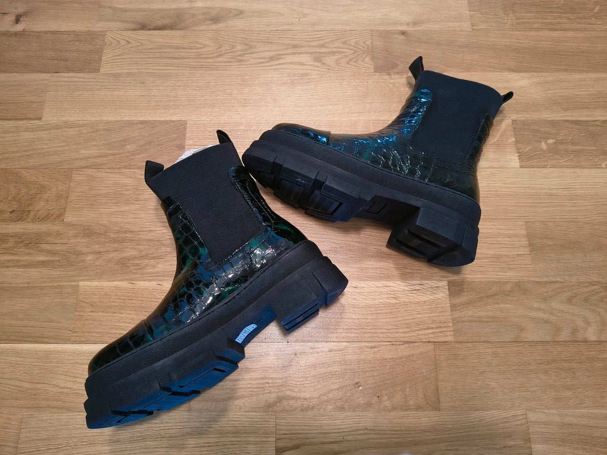 Copenhagen Shoes black and green leather Chelsea boots with crocodile pattern and elastic side inserts.
