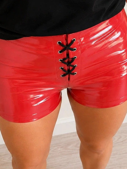 Red pajama shorts with shiny wet look and black lace-up detail.