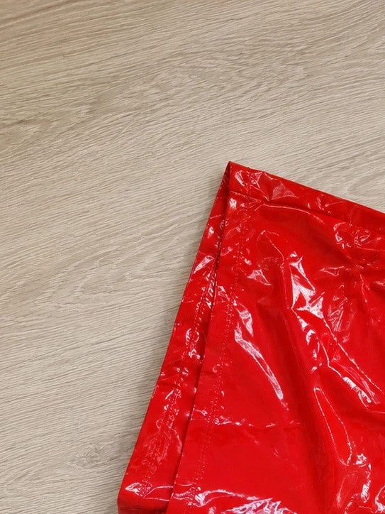Red pajama shorts with shiny wet look and black lace-up detail.