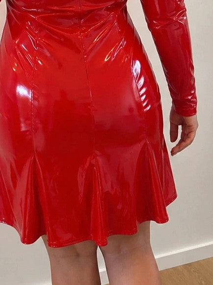 Red bandage dress with wetlook finish, standing collar, and long sleeves.