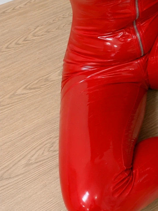 REI red jumpsuit with shiny wetlook finish and full-length zipper, size XL.