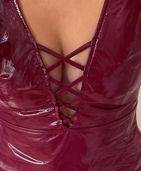 ALS burgundy bandage dress with shiny wetlook finish and decorative lacing details.
