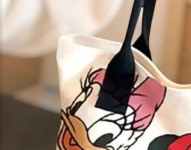 Cartoon cream shopping tote featuring Goofy design and synthetic material.