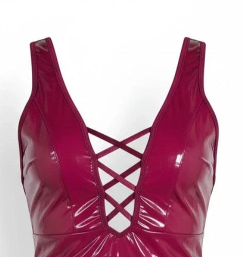 Bordeaux burgundy bandage dress with lace-up detail and glossy vinyl appearance.