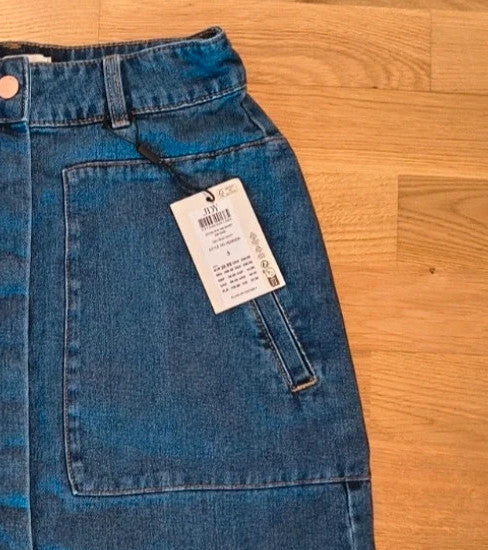 JDY blue knee-length skirt with synthetic material and tag attached.