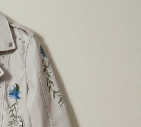Brand New beige and orange biker jacket with floral pattern in synthetic material.