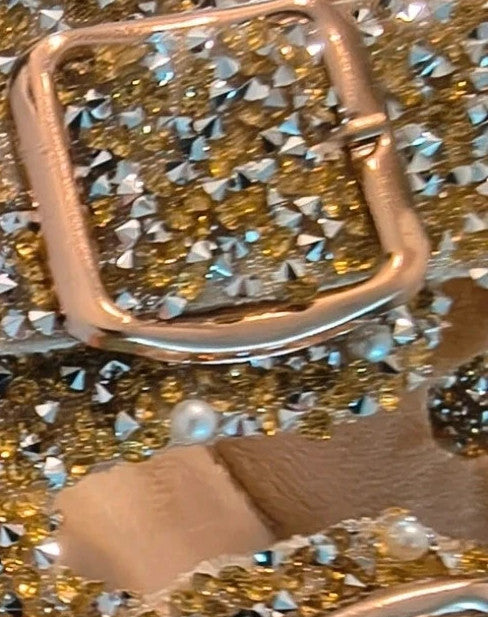 ALS gold slides with glitter, synthetic material, and unique sparkling design.