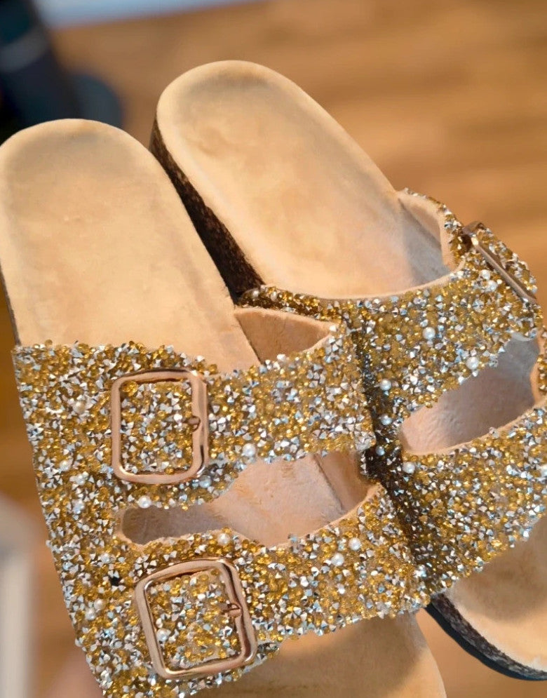 ALS gold slides with glitter, synthetic material, and unique sparkling design.