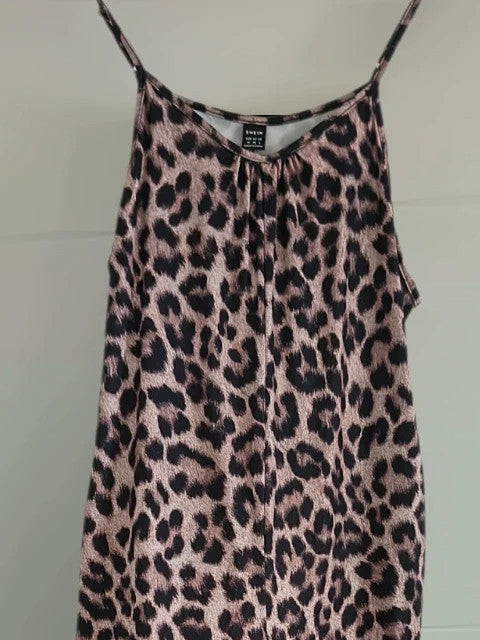 SheIn beige and brown jumpsuit with leopard print pattern and sleeveless design.