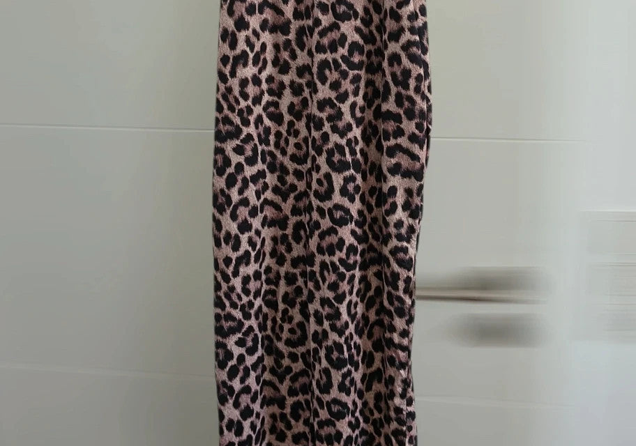 SheIn beige and brown jumpsuit with leopard print pattern and sleeveless design.