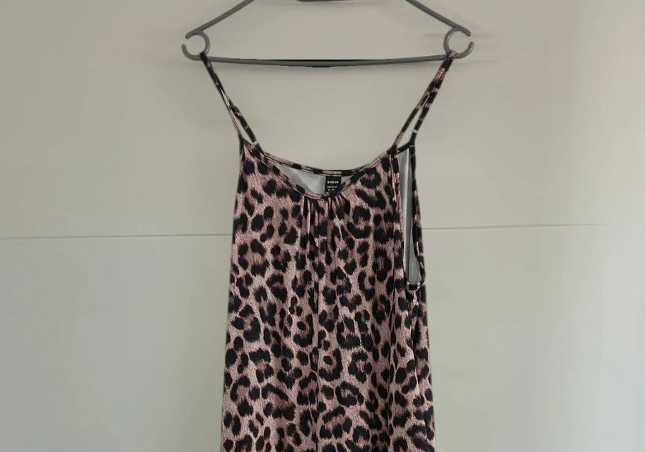 SheIn beige and brown jumpsuit with leopard print pattern and sleeveless design.