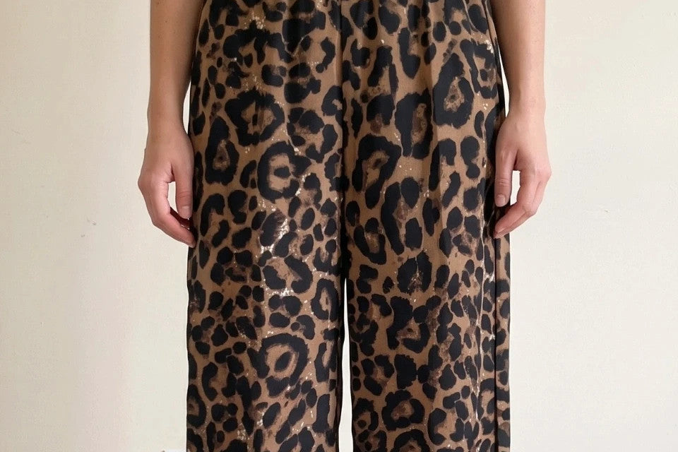 SheIn brown animal print flared pants synthetic material with leopard pattern.