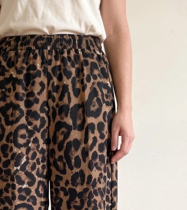 SheIn brown animal print flared pants synthetic material with leopard pattern.
