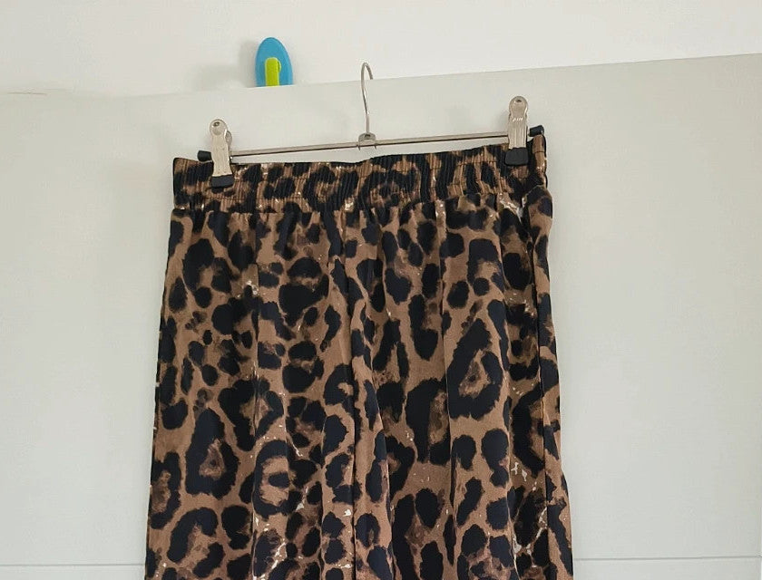SheIn brown animal print flared pants synthetic material with leopard pattern.