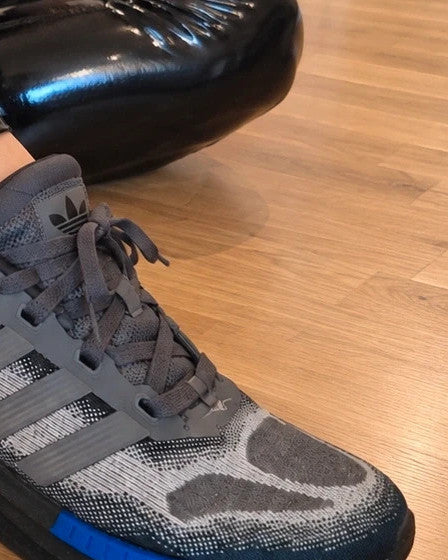 Adidas trainers grey black with blue accents, sporty design and distinctive sole.