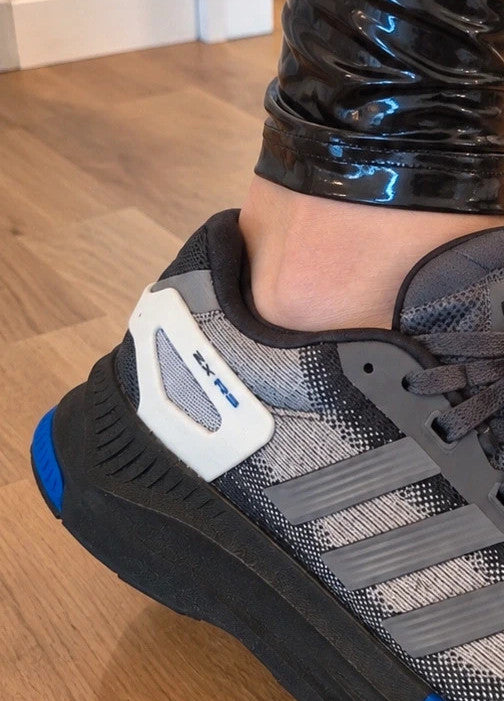 Adidas trainers grey black with blue accents, sporty design and distinctive sole.