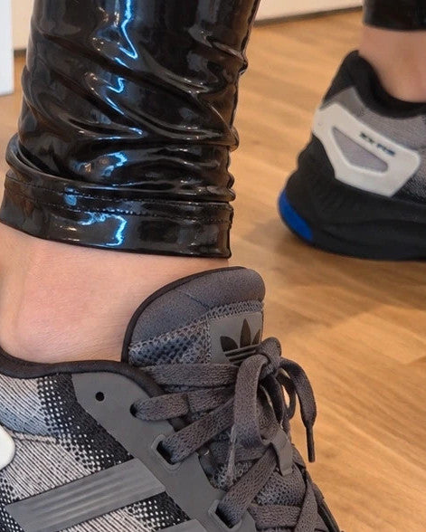 Adidas trainers grey black with blue accents, sporty design and distinctive sole.