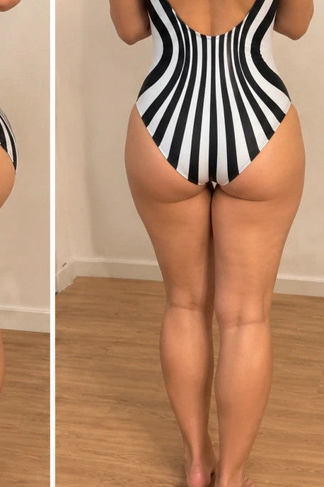 XXL one-piece swimsuit black and white striped optical print with deep neckline.