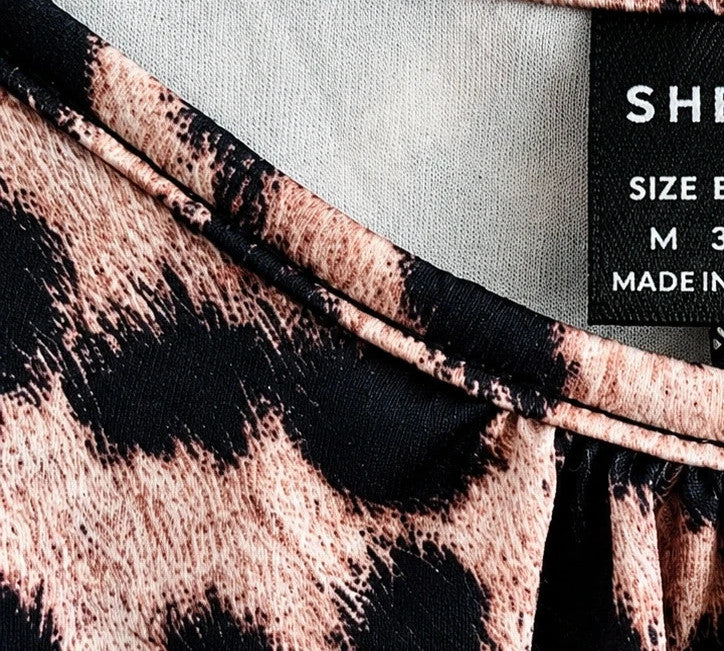 SheIn beige and brown leopard print jumpsuit with thin straps and wide legs.