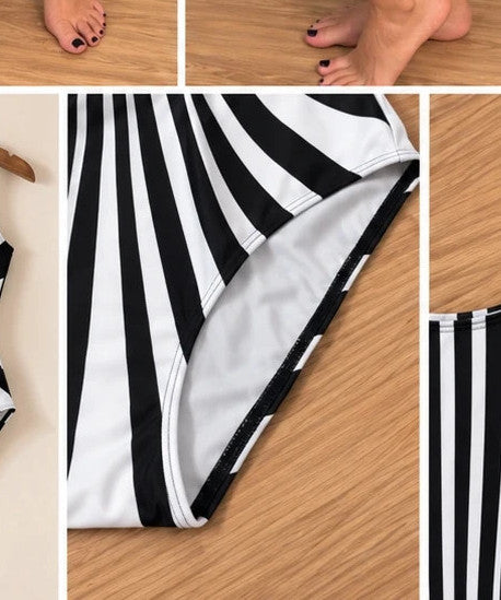 Muster one-piece swimsuit black and white with bold striped pattern and deep back cut.