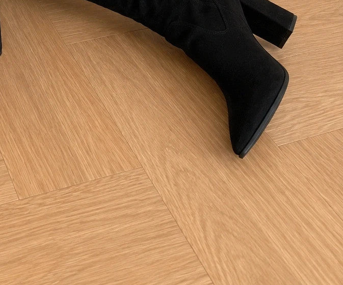 REI brown overknee slip-on boots in soft suede look with pointed toe and block heel.
