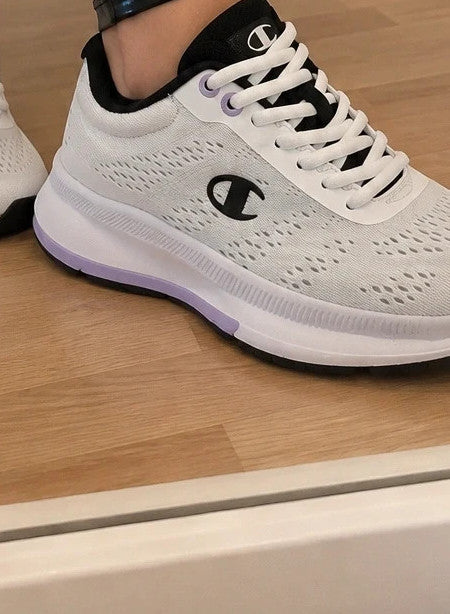 Champion white trainers with black and subtle lilac details, lightweight textile material.